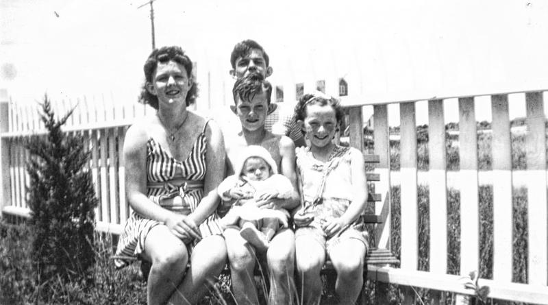 Gathered outside the Walsh cottage on a summer day are (l-r) Mary Walsh, John (Jackie) Walsh, Jerome (Jerry) Walsh holding baby Patricia Walsh, and Joan Walsh on the right. WALSH FAMILY PHOTO